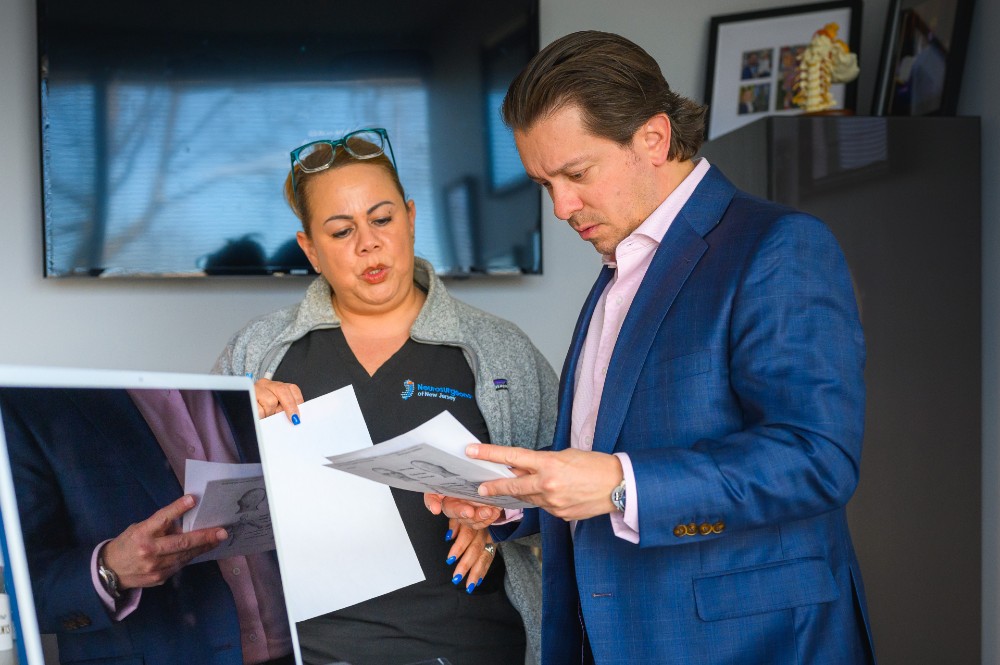Dr. Bassani reviewing results with a nurse.