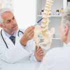 Spine doctor talking to a patient about spine surgery.