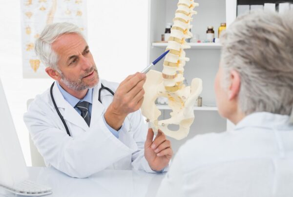Spine doctor talking to a patient about spine surgery.