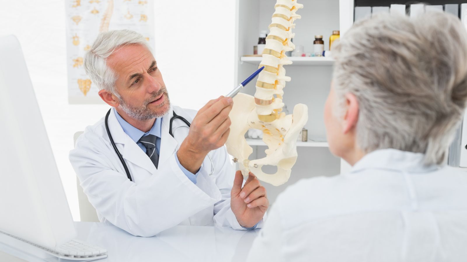 Spine doctor talking to a patient about spine surgery.