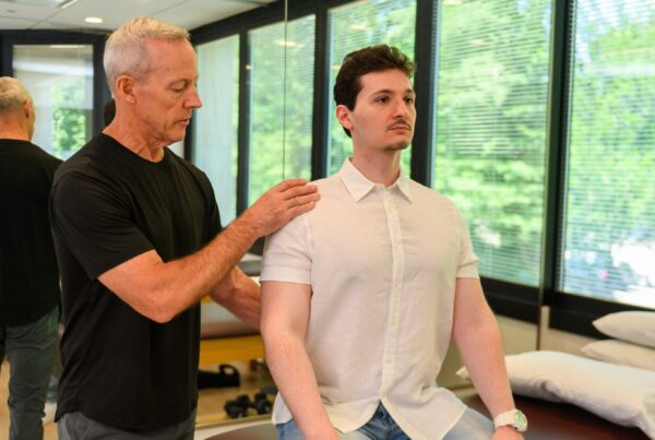 Bill Gilligan working with a patient on spinal stenosis exercises