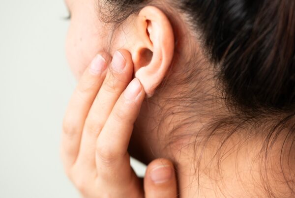 Young woman suffering from pain