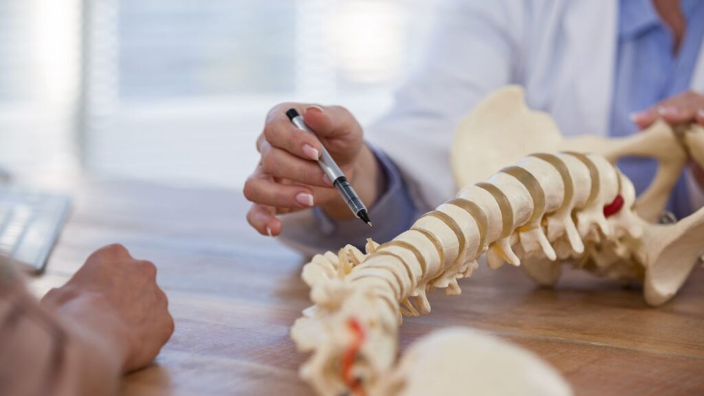 Doctor reviewing exercises after acdf surgery.