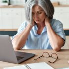 woman with fatigue and neck pain.