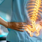 Patient is feeling hip pain while talking to a doctor.