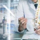 Doctor talking to patient about spine surgery.